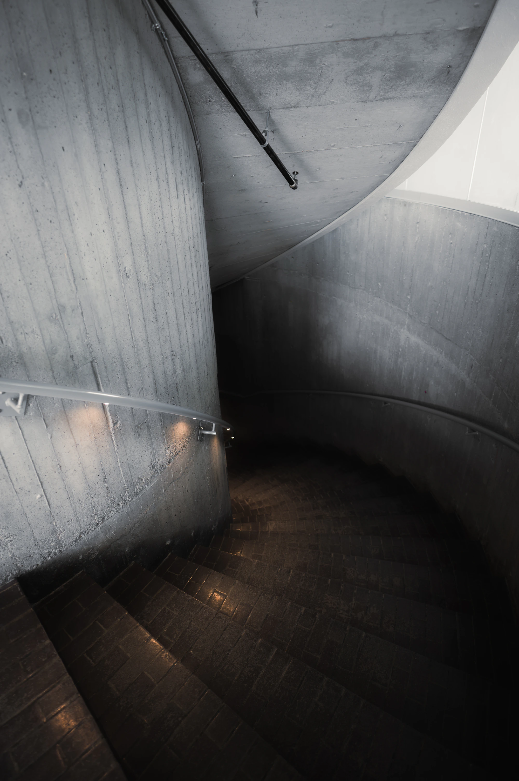 The interdependent curves and structure of a staircase.