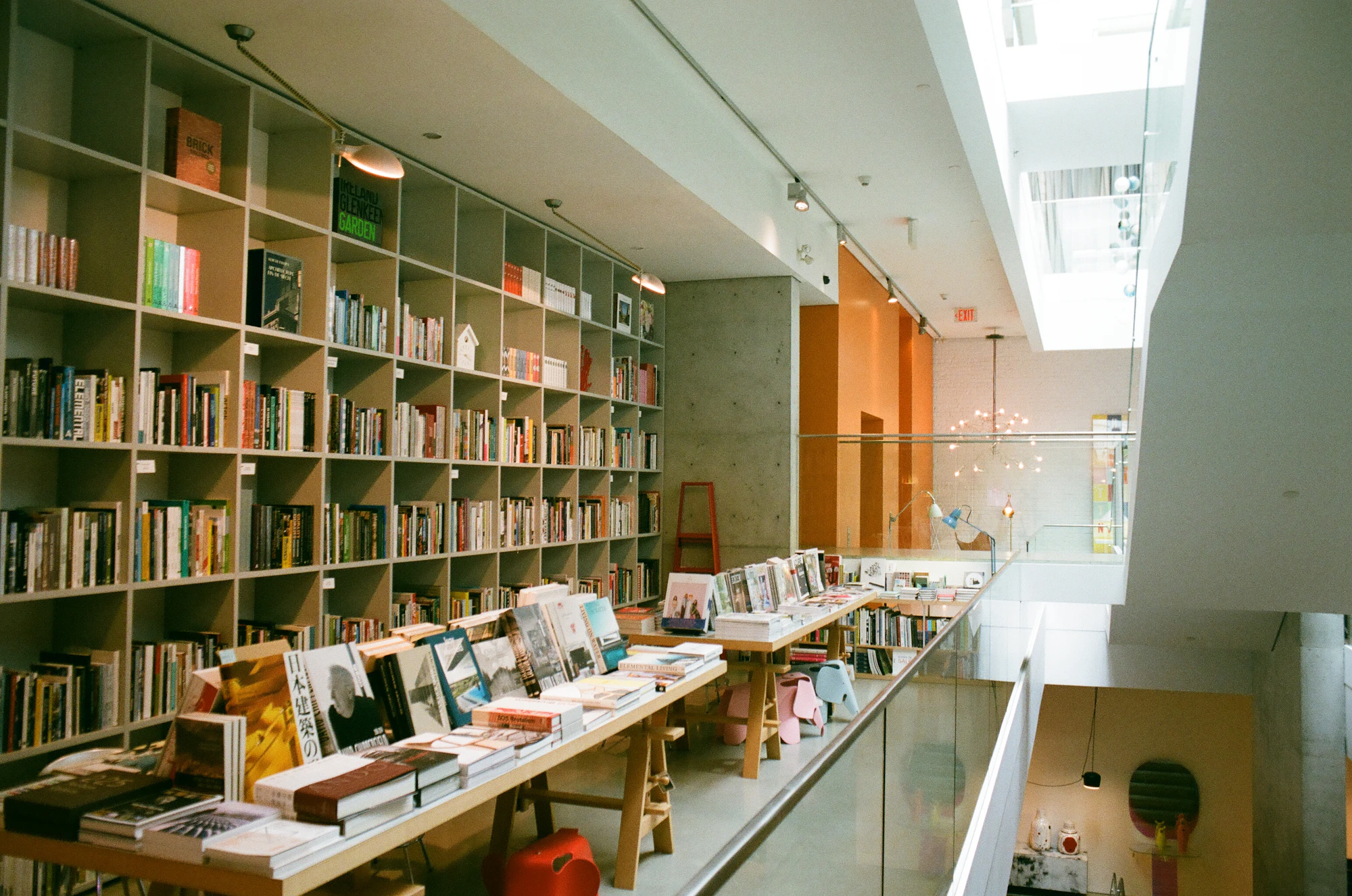 Wooden bookshelves and reading tables in a library.